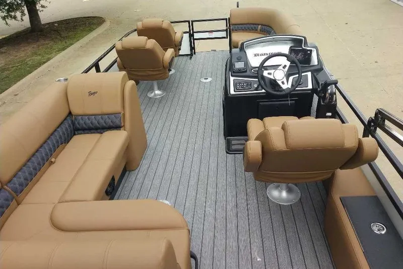Slide: The Image of Luxurious 2027 Ranger 220FC boat interior with tan seating and modern steering console. - 4