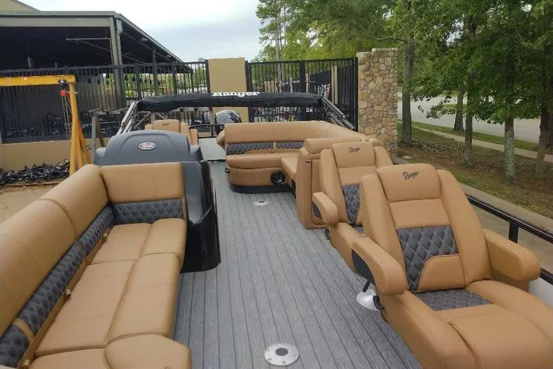 Slide: The Image of 2027 Ranger 220FC boat with luxurious tan seating and spacious deck. - 5