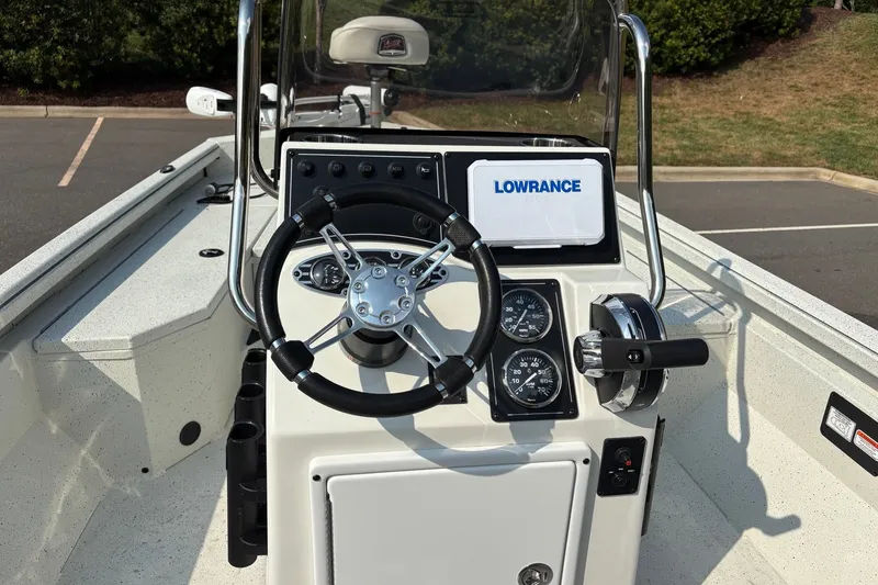 Slide: The Image of 2027 Ranger RB190 boat console with steering wheel, gauges, and Lowrance electronics. - 8
