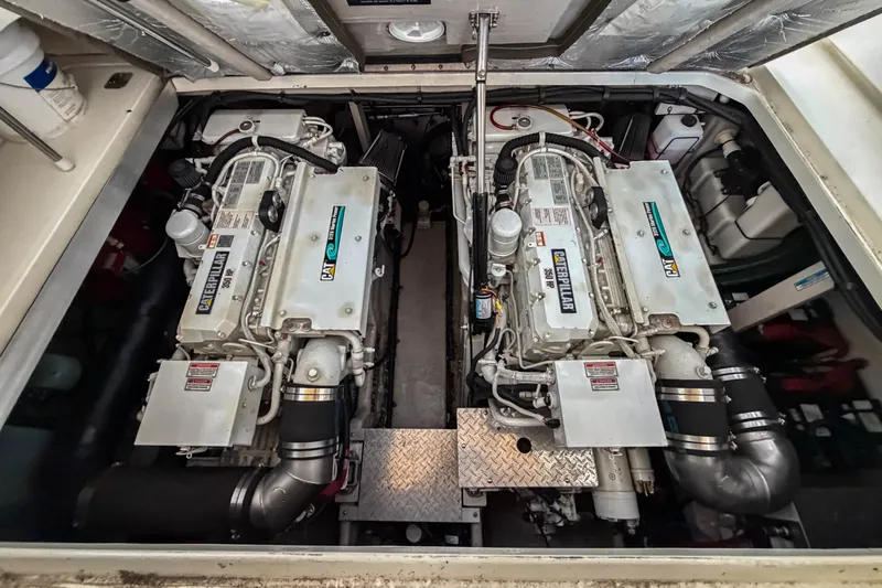Slide: The Image of Engine room of 2003 Sea Ray 410 Sundancer with twin Caterpillar engines. - 42