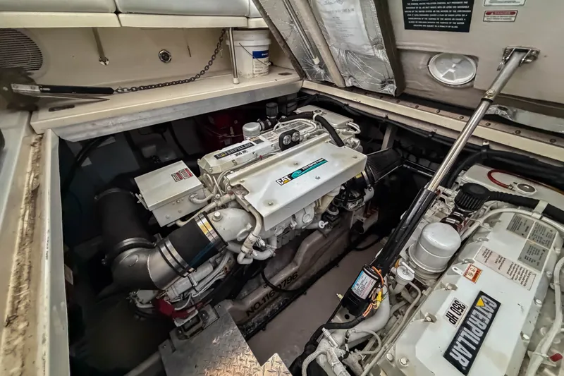 Slide: The Image of Engine compartment of a 2003 Sea Ray 410 Sundancer with Caterpillar engines. - 43