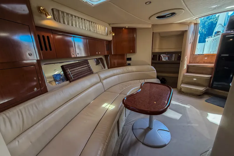 Slide: The Image of Luxurious interior of a 2003 Sea Ray 410 Sundancer yacht with elegant seating and wooden cabinetry. - 34