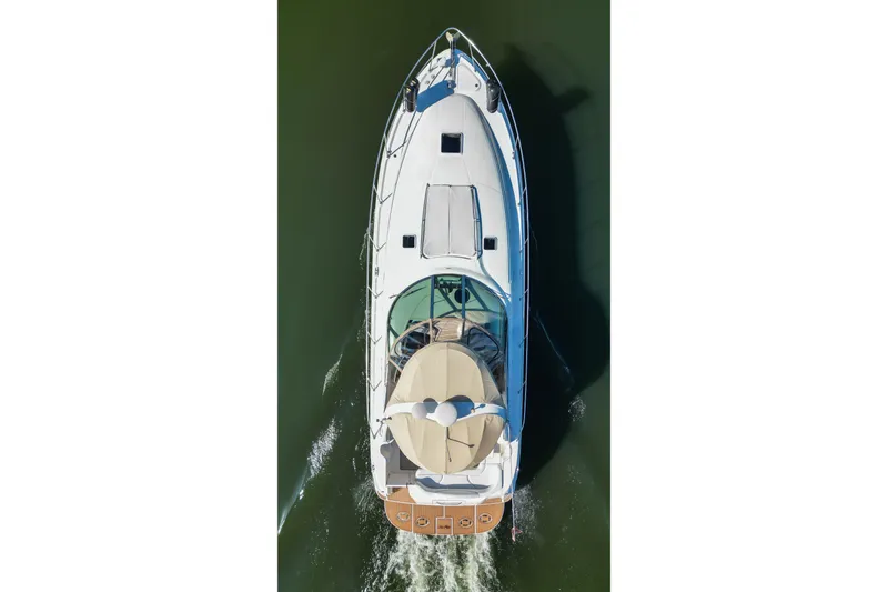 Slide: The Image of Aerial view of 2003 Sea Ray 410 Sundancer yacht cruising on water. - 16