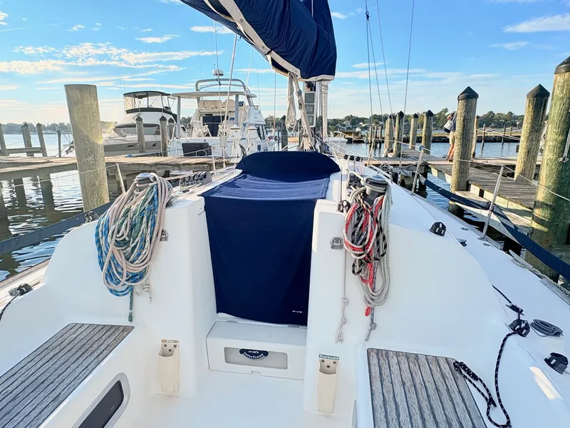 Slide: The Image of The image shows the cockpit of a 2007 Beneteau First 36.7, with ropes and docks in the background. - 9