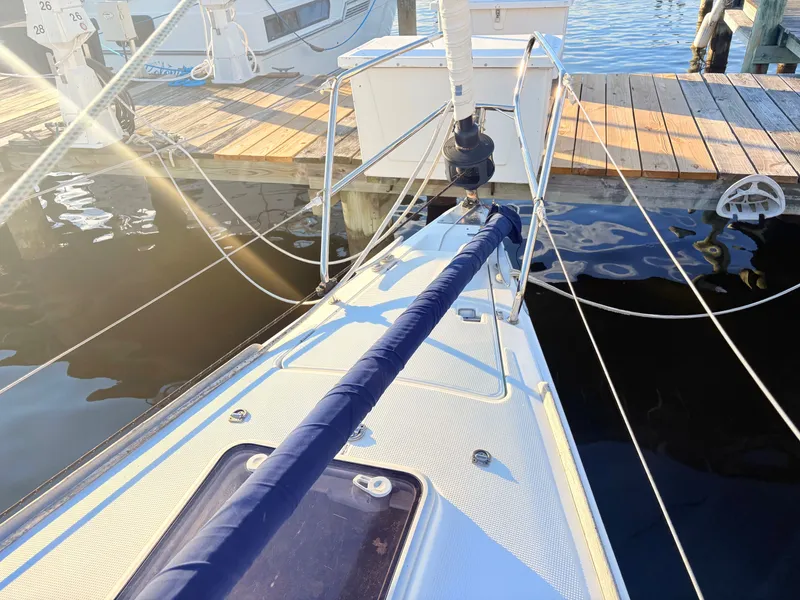Slide: The Image of The deck of a 2007 Beneteau First 36.7 at the dock with sailing equipment. - 26