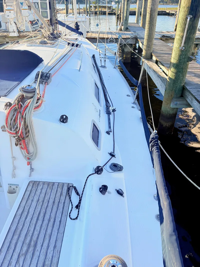 Slide: The Image of The image shows a 2007 Beneteau First 36.7 sailboat docked. - 23