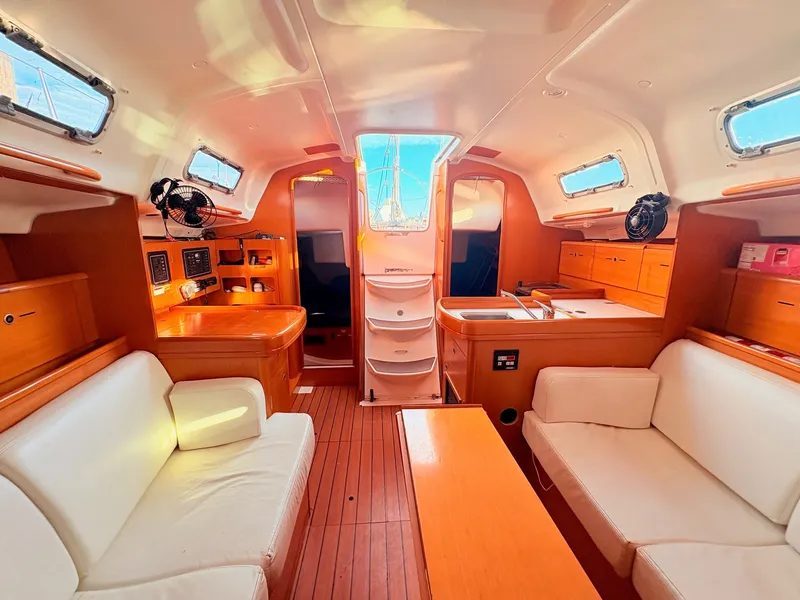 Slide: The Image of Interior of a 2007 Beneteau First 36.7 with wood floors and white upholstery. - 22