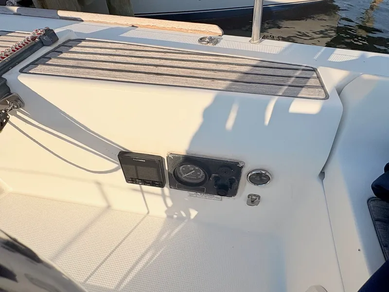 Slide: The Image of The image shows the cockpit of a 2007 Beneteau First 36.7 with control instruments. - 7