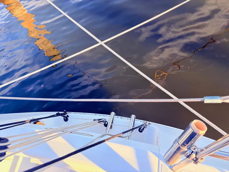 Slide: The Image of Close-up of the rigging on a 2007 Beneteau First 36.7 by the water. - 31