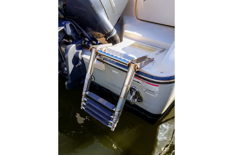 Slide: The Image of 2016 Grady-White Freedom 275 boat with a stainless steel swim ladder. - 31