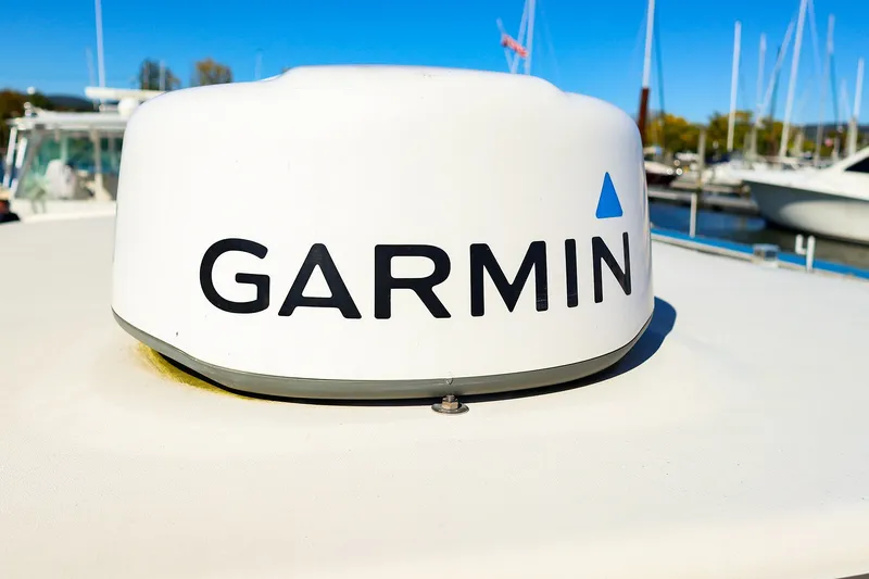 Slide: The Image of Garmin radar on 2016 Grady-White Freedom 275 boat, docked at marina. - 33