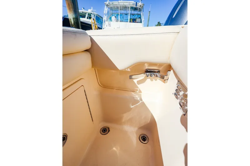 Slide: The Image of Interior view of a 2016 Grady-White Freedom 275 boat, showcasing seating and fixtures. - 28