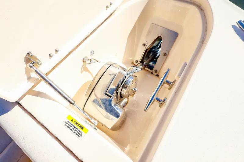 Slide: The Image of Anchor winch on 2016 Grady-White Freedom 275 boat, featuring stainless steel components. - 19