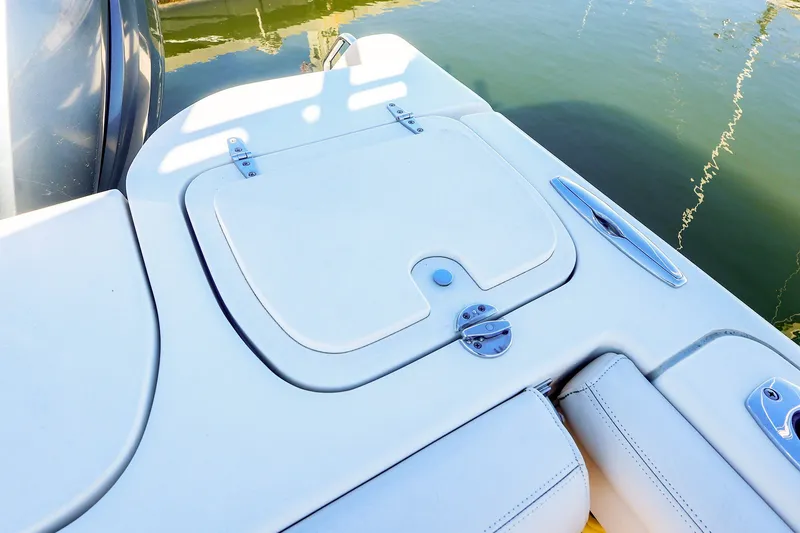 Slide: The Image of 2016 Grady-White Freedom 275 boat deck with storage compartment and water view. - 21
