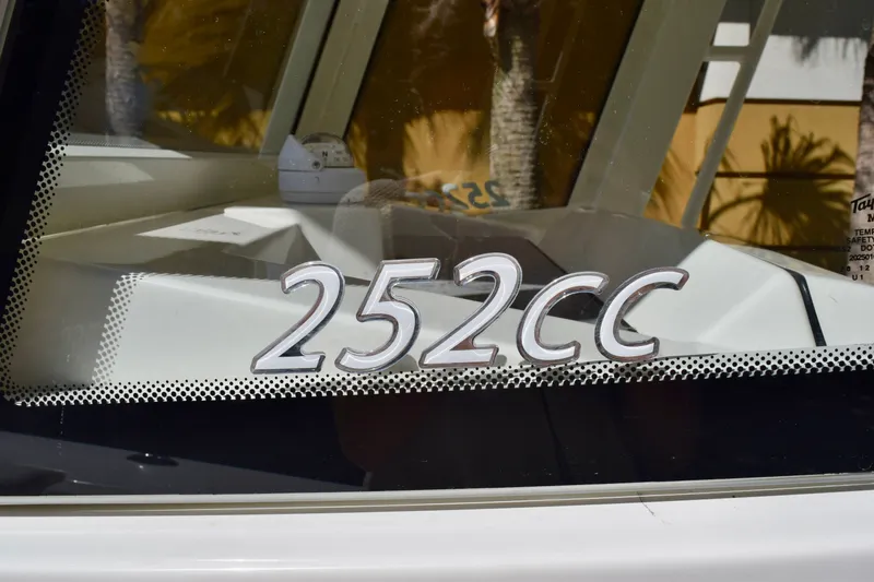 Slide: The Image of Sailfish 252 CC boat model emblem on window, 2027 edition. - 15
