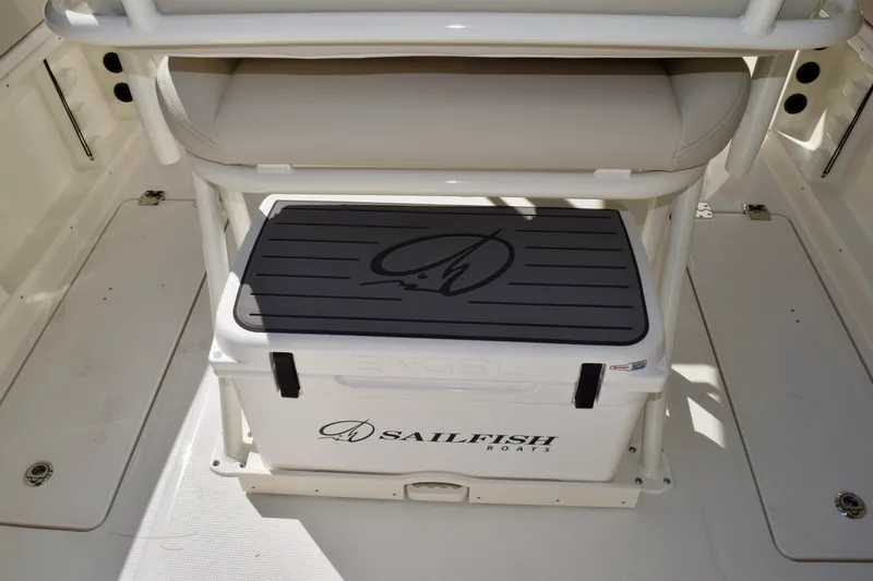 Slide: The Image of 2027 Sailfish 252 CC boat interior with Engel cooler and cushioned seating. - 20