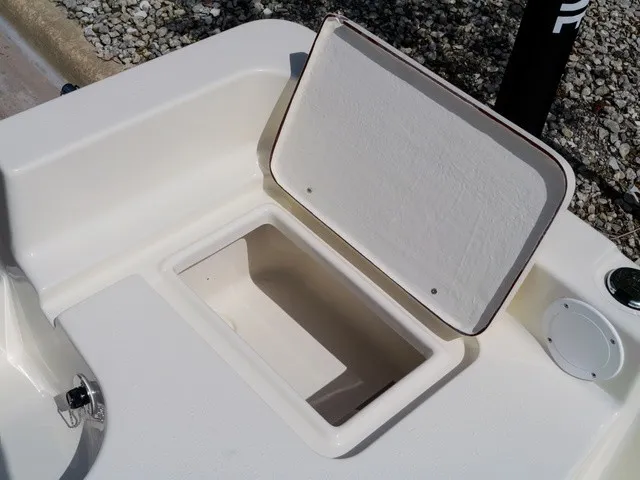 Slide: The Image of An open storage compartment on a 2027 Bulls Bay 2000 boat. - 27