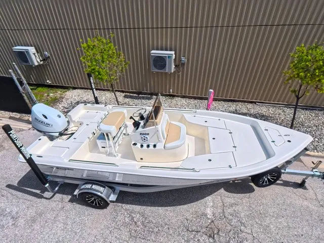 Slide: The Image of 2027 Bulls Bay 2000 on a trailer, featuring an outboard motor and center console. - 18