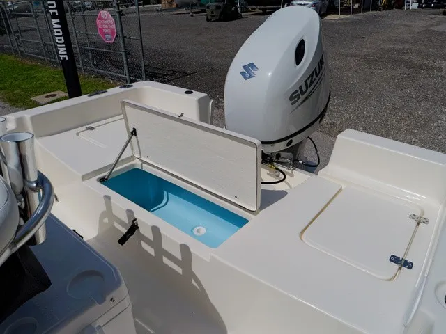 Slide: The Image of The image shows the stern of a Bulls Bay 2000 boat with a Suzuki outboard motor. - 3