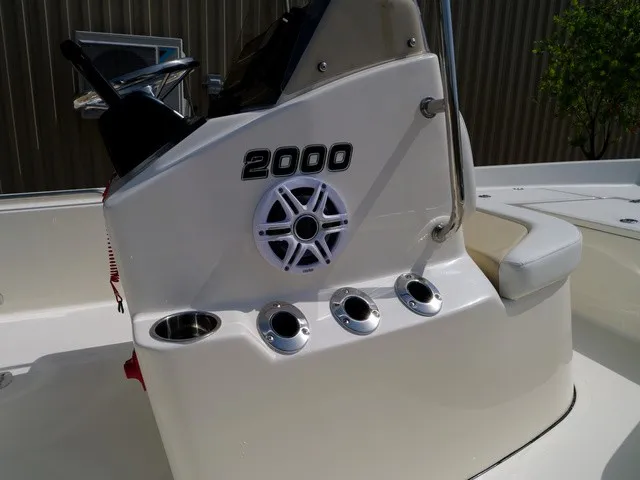 Slide: The Image of The image shows the cockpit of a Bulls Bay 2000 boat with a speaker and cup holders. - 11