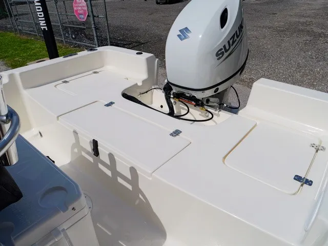 Slide: The Image of The image shows the stern of a Bulls Bay 2000 boat with a Suzuki outboard motor. - 28