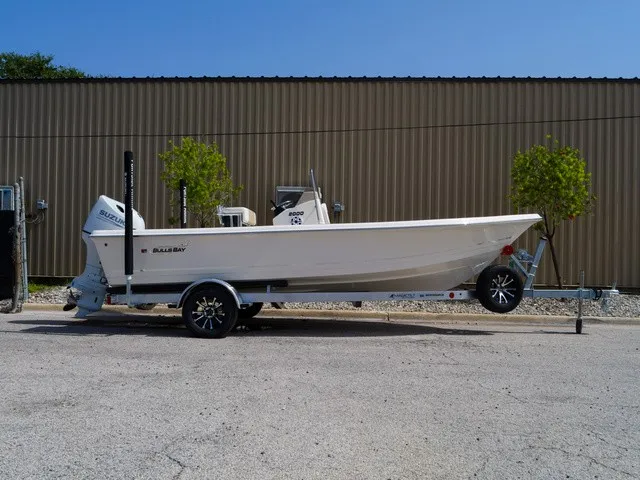 Slide: The Image of A 2027 Bulls Bay 2000 boat on a trailer, parked on a paved lot. - 5