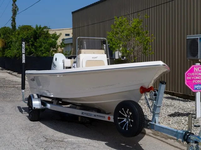 Slide: The Image of A 2027 Bulls Bay 2000 boat on a trailer, parked beside a building. - 33
