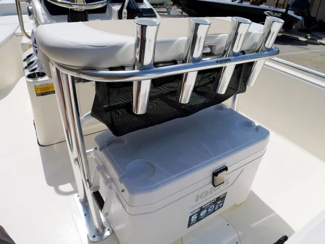 Slide: The Image of Bulls Bay 2000 from 2027 featuring a white cooler beneath a seat with fishing rod holders. - 8
