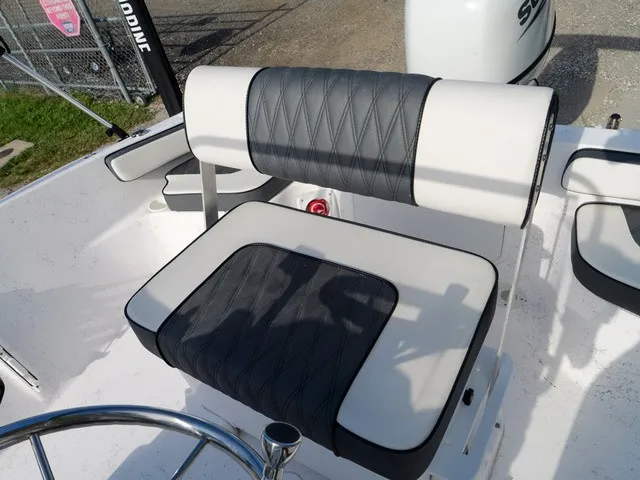 Slide: The Image of The image shows a cushioned bench seat on a boat with black and white upholstery. - 7