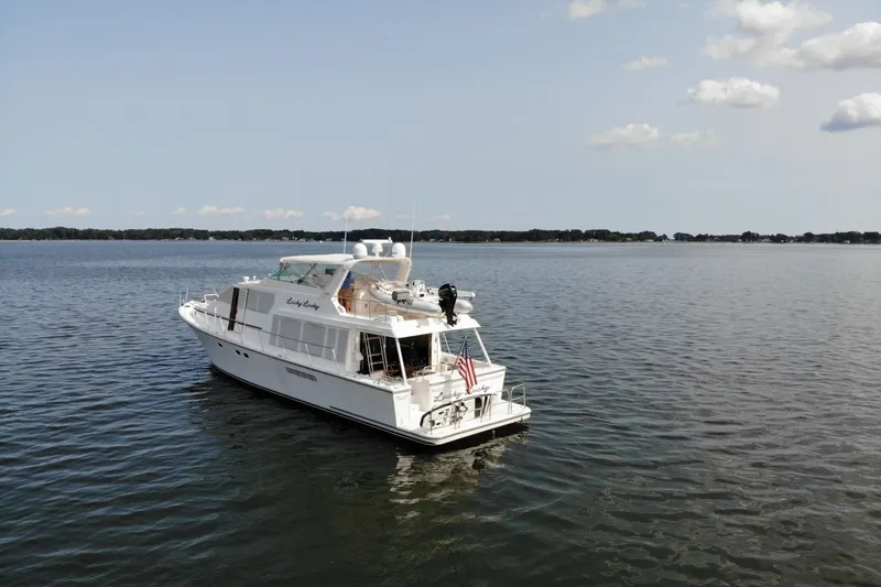 Slide: The Image of 2001 Pacific Mariner motor yacht cruising on a calm lake under a clear sky. - 3