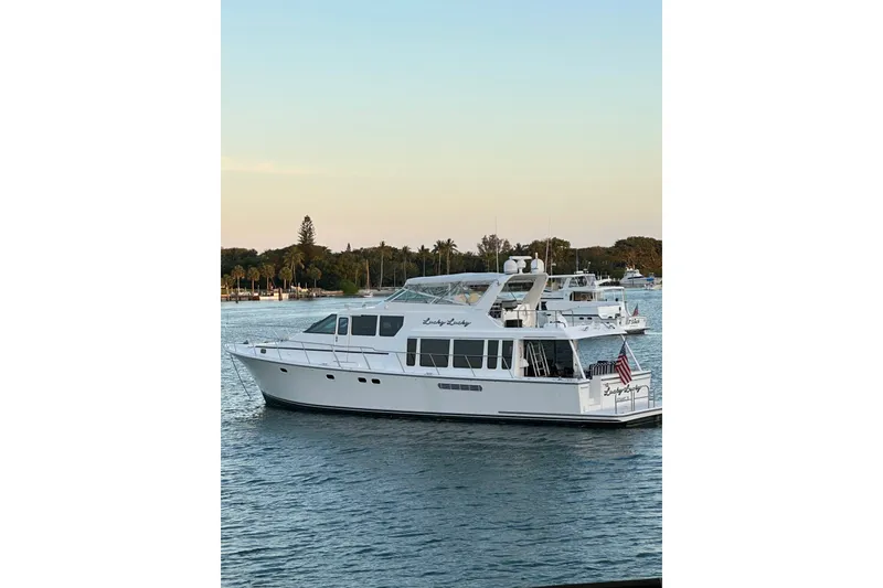 Slide: The Image of 2001 Pacific Mariner Motor Yacht on calm water at sunset. - 2