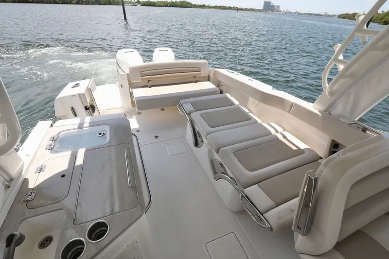 Slide: The Image of 2016 Boston Whaler 320 Vantage boat interior with seating and water view. - 14