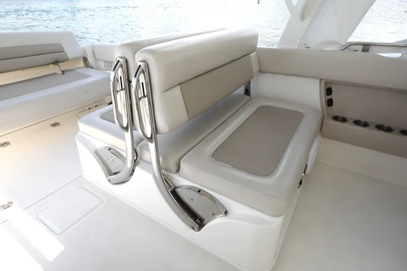 Slide: The Image of Interior seating of a 2016 Boston Whaler 320 Vantage boat, featuring cushioned benches. - 22