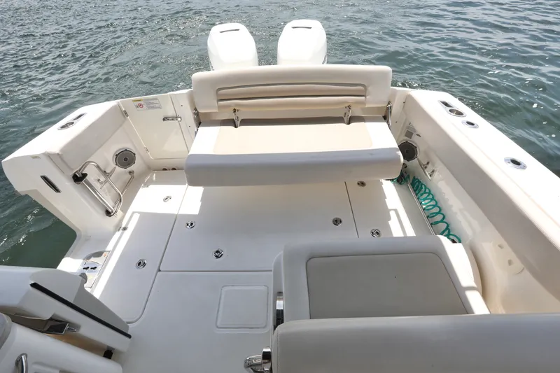 Slide: The Image of 2016 Boston Whaler 320 Vantage boat interior with seating and ocean view. - 15