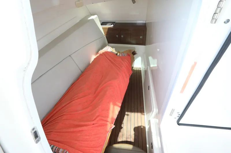 Slide: The Image of Interior cabin of 2016 Boston Whaler 320 Vantage with cozy sleeping area. - 21