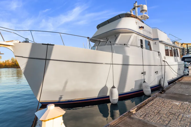 Slide: The Image of 2006 Solander Eclipse Steel Trawler docked at marina under clear blue sky. - 1