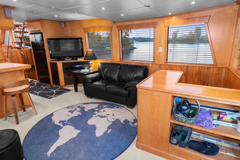 Slide: The Image of Luxurious interior of 2006 Solander Eclipse Steel Trawler with leather sofa and world map rug. - 3