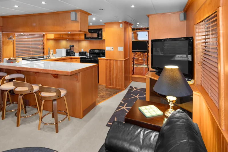 Slide: The Image of Luxurious interior of 2006 Solander Eclipse Steel Trawler with modern kitchen and cozy seating area. - 17