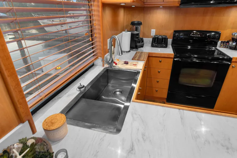 Slide: The Image of Modern kitchen interior of 2006 Solander Eclipse Steel Trawler with stainless steel sink and appliances. - 11