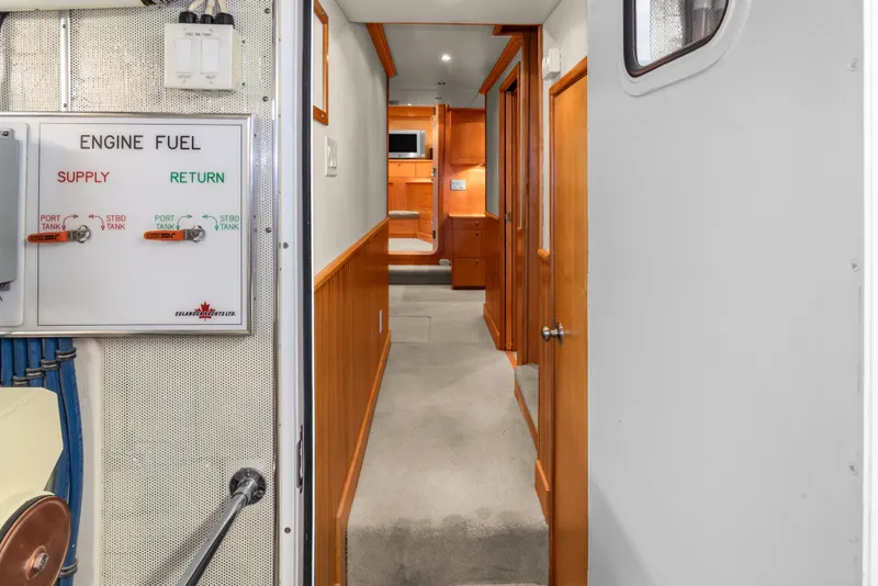Slide: The Image of Interior hallway of 2006 Solander Eclipse Steel Trawler with engine fuel panel. - 41