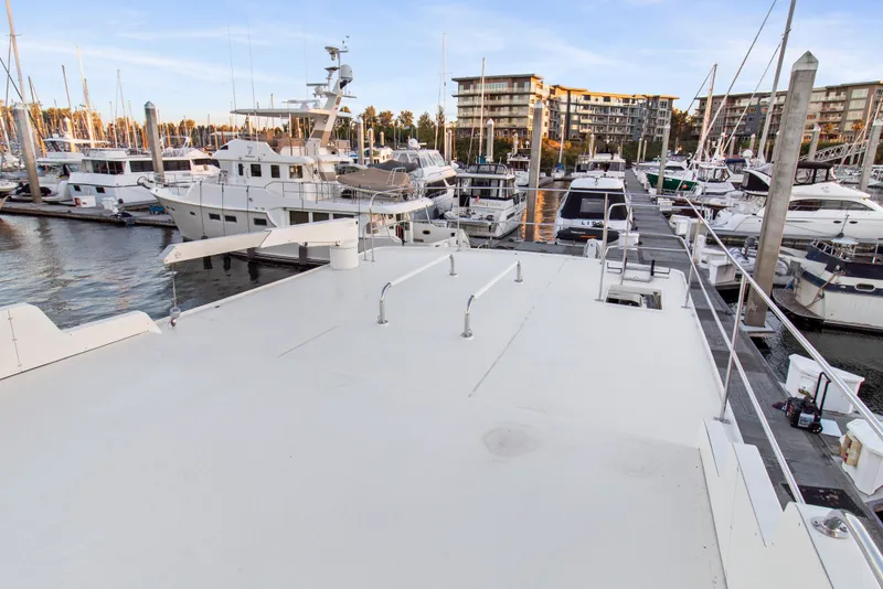 Slide: The Image of Marina view with Solander Eclipse Steel Trawler, 2006, docked among various boats. - 65