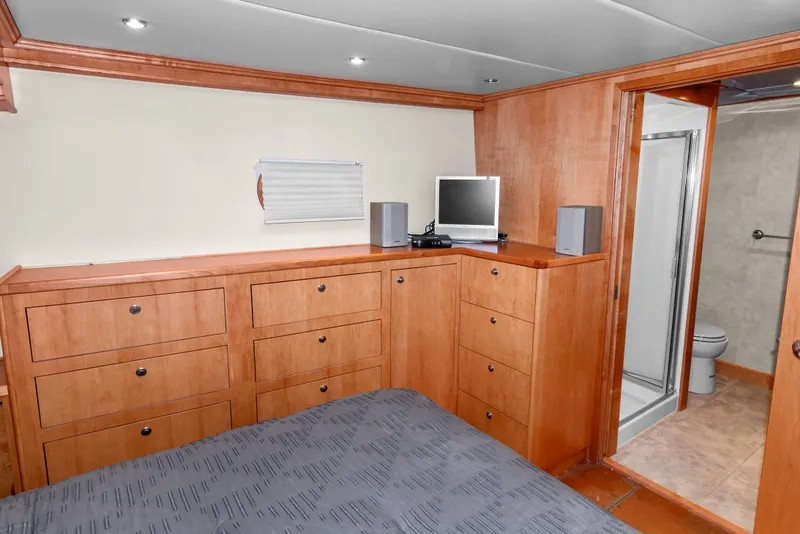 Slide: The Image of Interior of 2006 Solander Eclipse Steel Trawler with wood cabinetry, bed, and ensuite bathroom. - 29