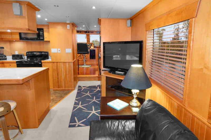 Slide: The Image of Interior of 2006 Solander Eclipse Steel Trawler with modern kitchen and cozy living area. - 14