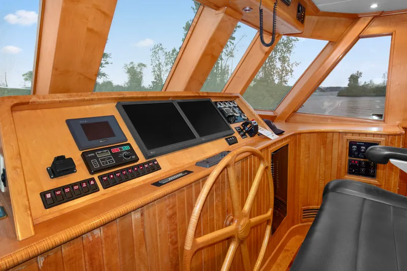 Slide: The Image of Pilothouse of 2006 Solander Eclipse Steel Trawler with wooden helm and modern navigation equipment. - 19