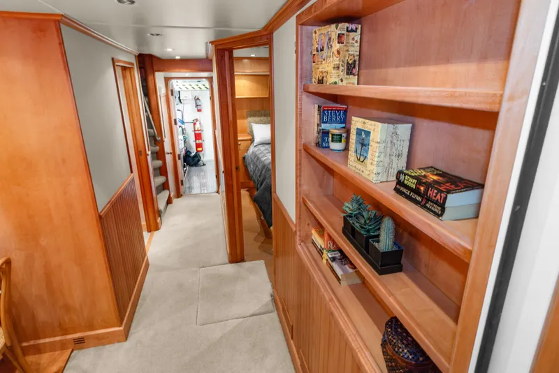 Slide: The Image of Interior of 2006 Solander Eclipse Steel Trawler with bookshelves and cozy hallway. - 39