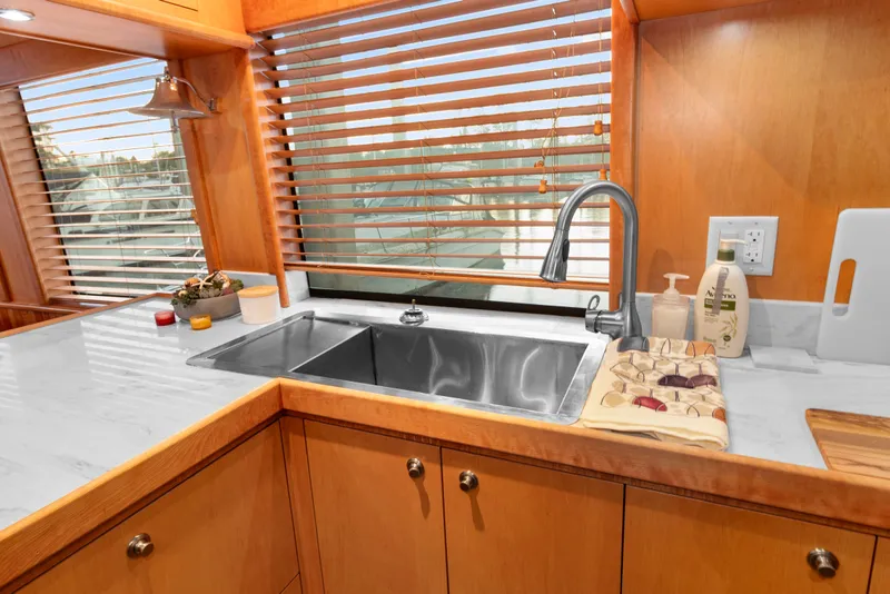 Slide: The Image of Luxurious kitchen interior of 2006 Solander Eclipse Steel Trawler with wooden cabinetry and modern sink. - 8