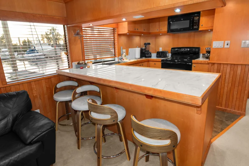 Slide: The Image of Luxurious kitchen interior of 2006 Solander Eclipse Steel Trawler with modern appliances and seating. - 4