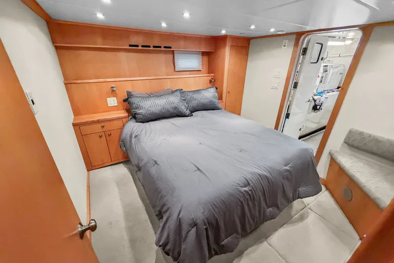 Slide: The Image of Cozy bedroom in 2006 Solander Eclipse Steel Trawler with modern wood accents and gray bedding. - 30