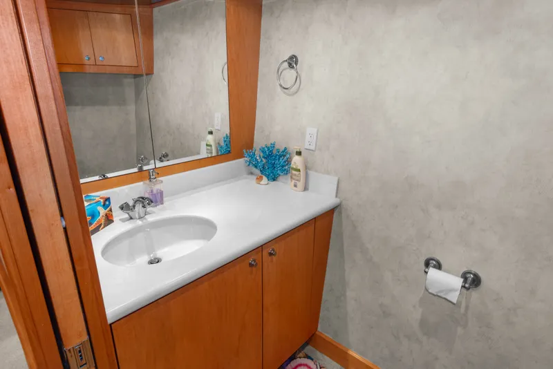 Slide: The Image of Bathroom interior of 2006 Solander Eclipse Steel Trawler with sink, mirror, and wooden cabinetry. - 37