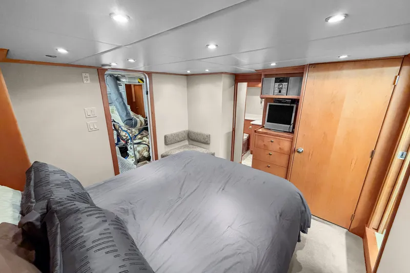 Slide: The Image of Luxurious cabin interior of 2006 Solander Eclipse Steel Trawler with bed, TV, and storage. - 32
